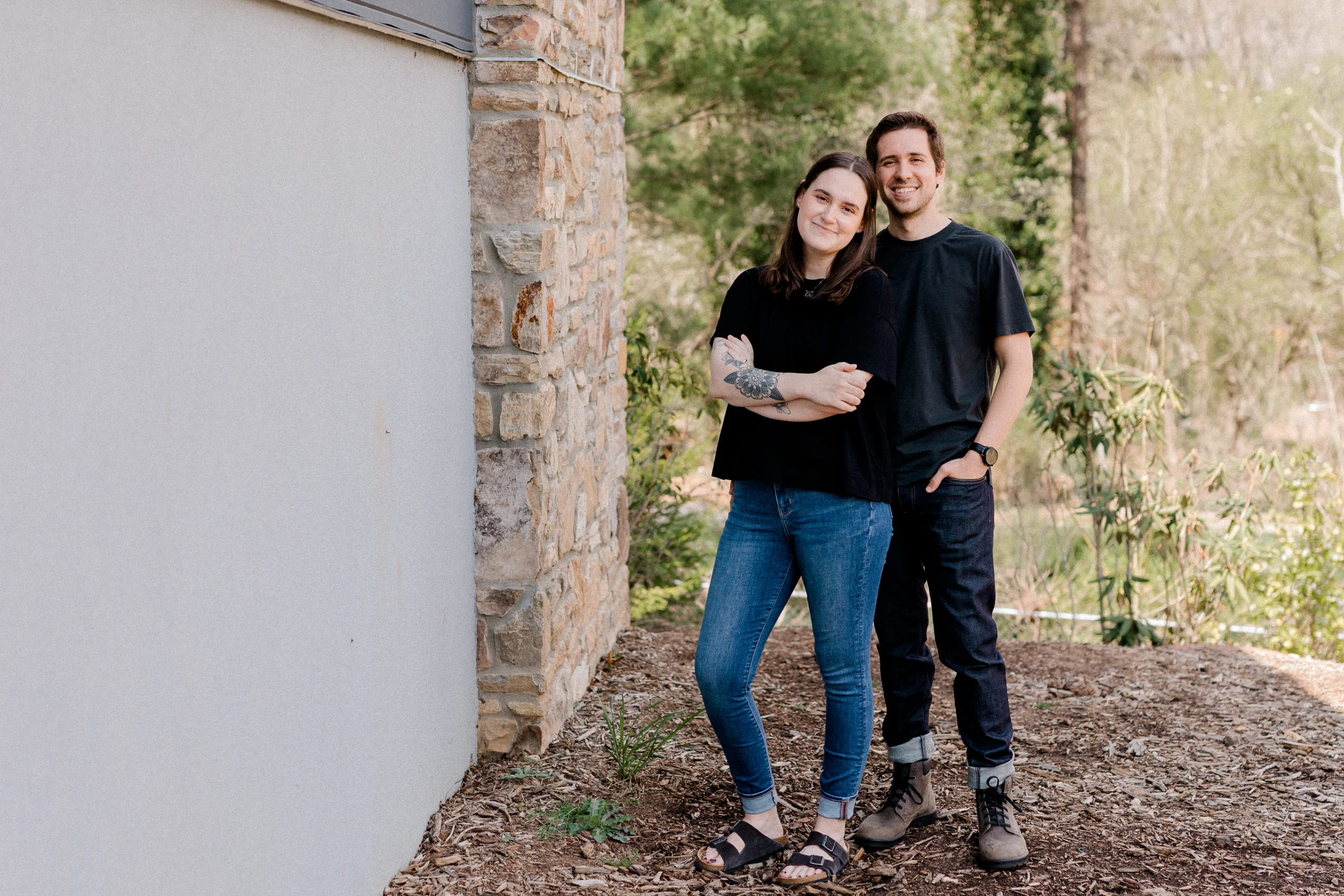 Owner & operators of Barefoot build standing outside smiling