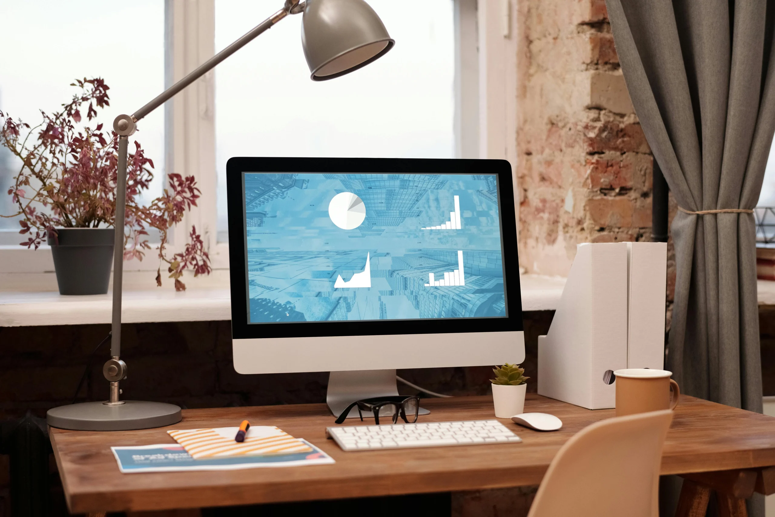 Minimal office desk with notepad and pen