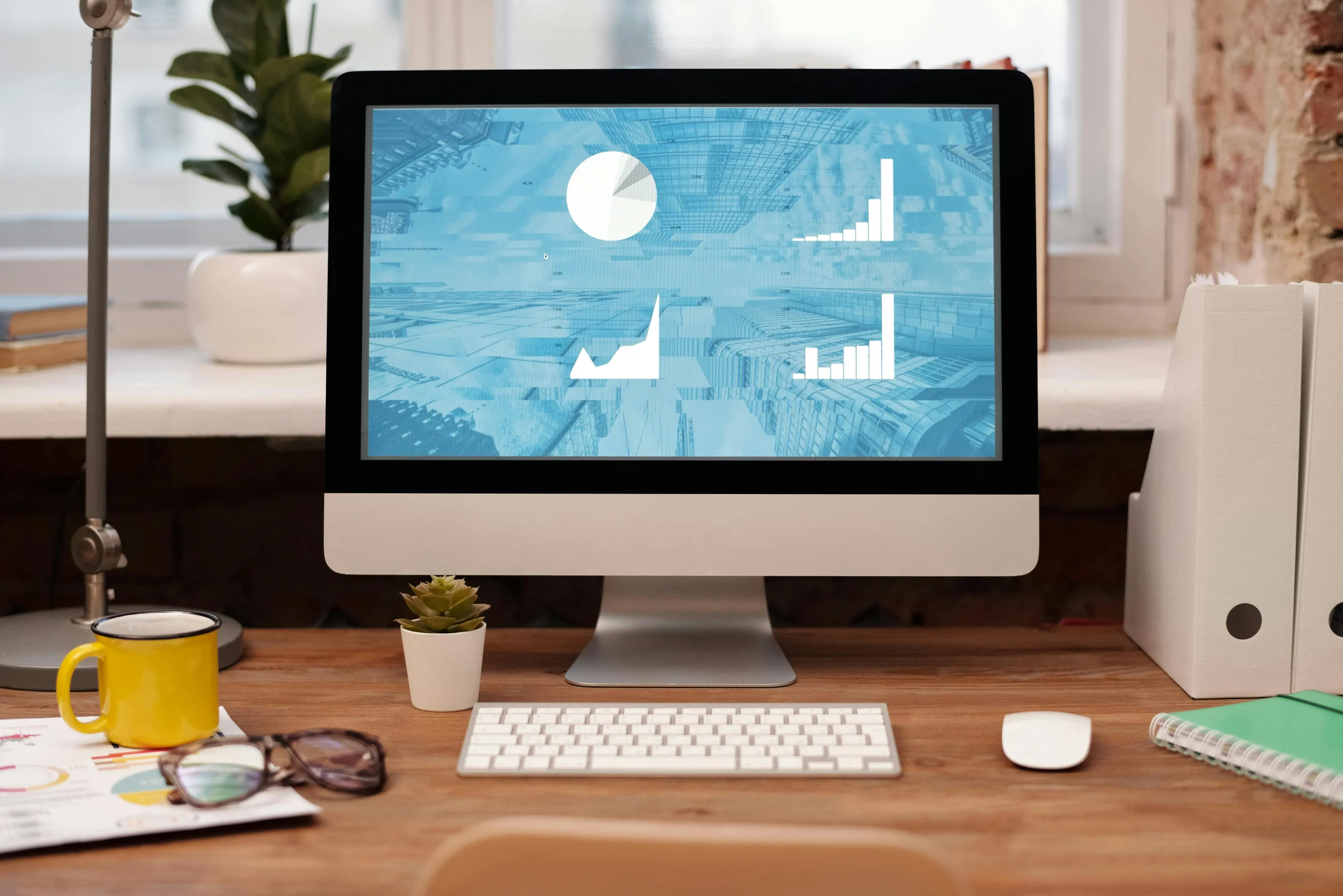 Modern workspace with desktop computer and natural light