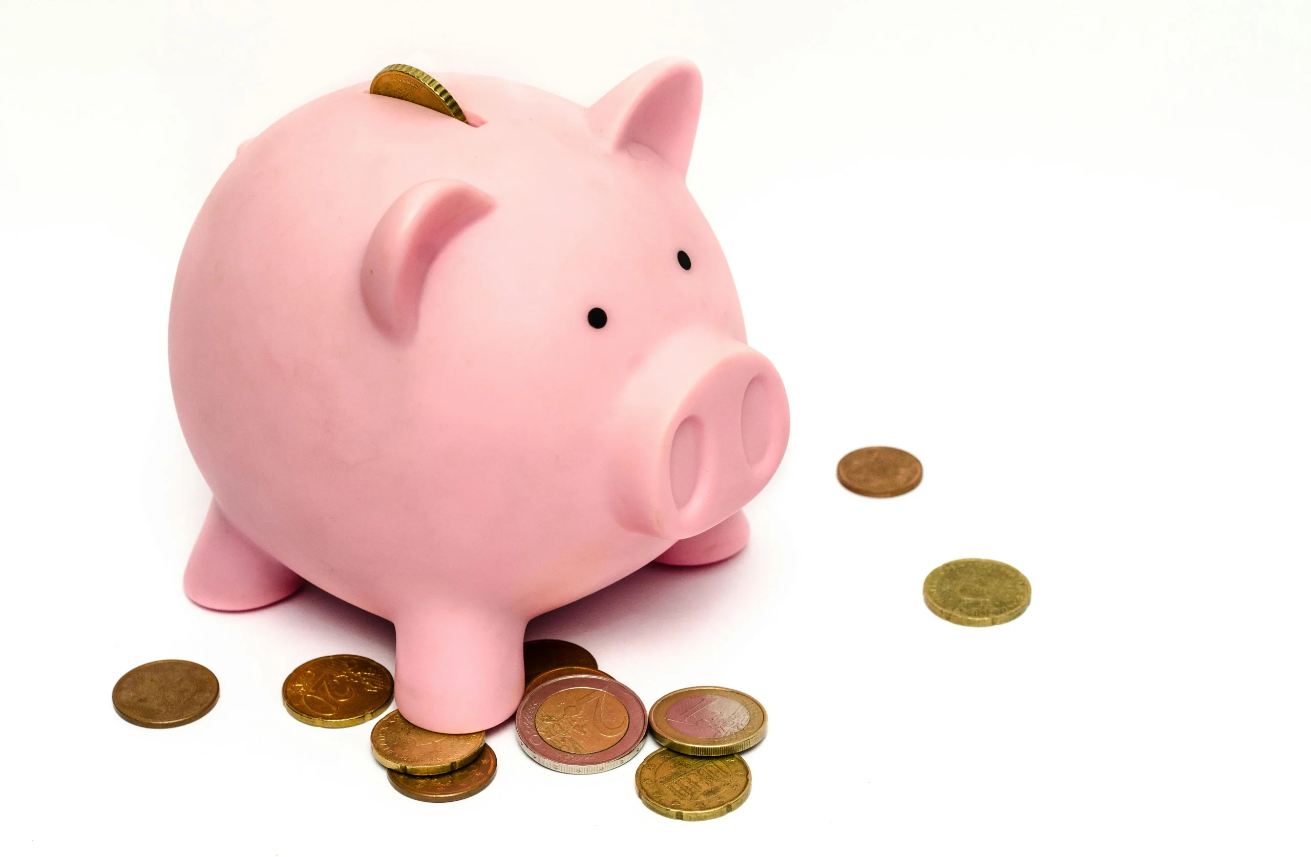 piggy bank and coins illustrating landing page vs full website cost comparison